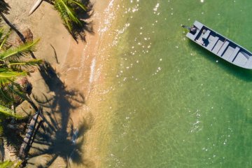 aerial photography of boats on seashore 